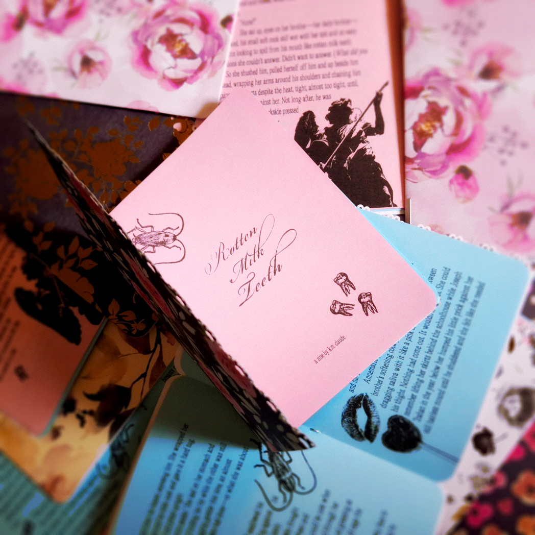 zine titled rotten milk teeth atop pile of other zines with varied covers